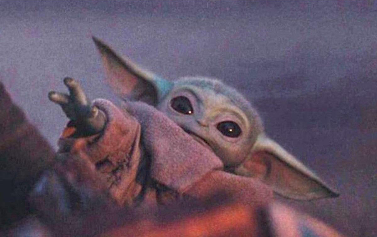 Baby Yoda reaching for something that&#x27;s far away