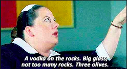 Dorota orders a vodka on the rocks, big glass, not too many rocks, three olives