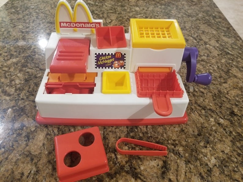 A red and white McDonald&#x27;s Chicken McNugget Play-Doh play set 