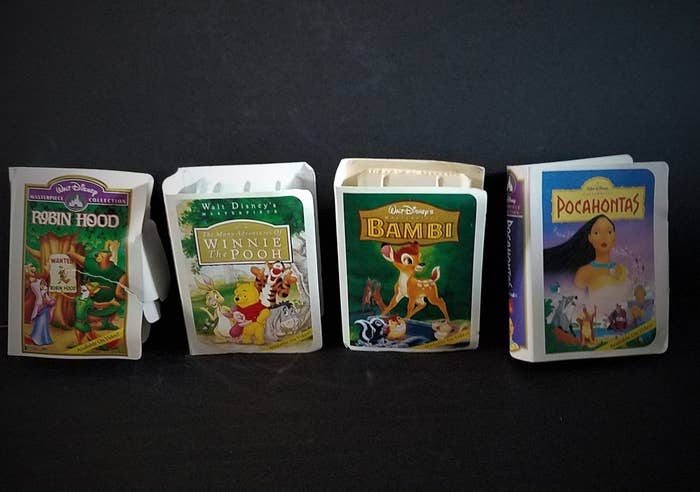 Mini-VHS Happy Meal cases of Robin Hood, Winnie the Pooh, Bambi, and Pocahontas 