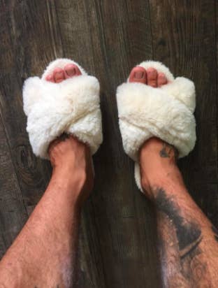 different reviewer pic of feet wearing the white version of the slippers