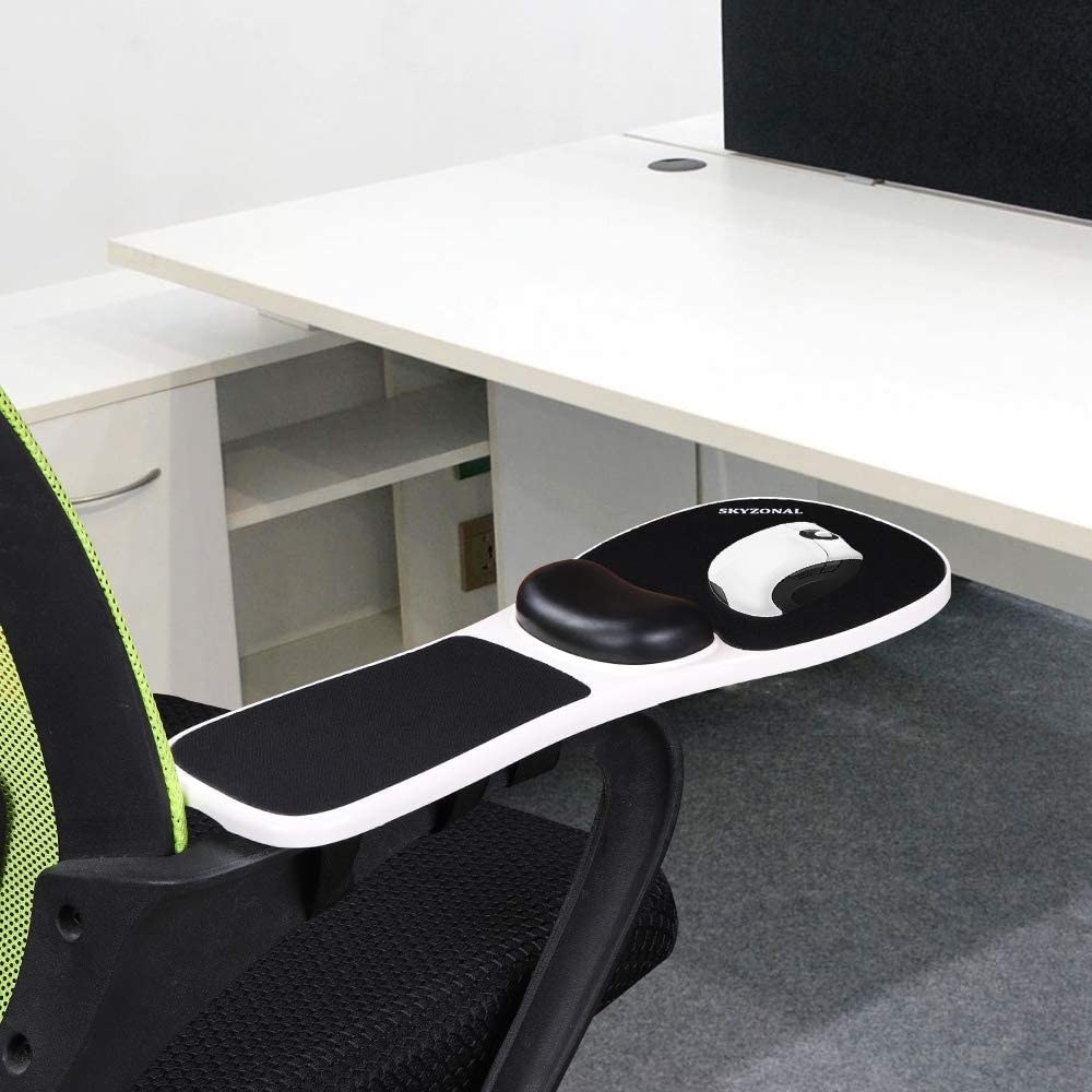 A wrist rest on the arm of a chair with a mouse on top of it