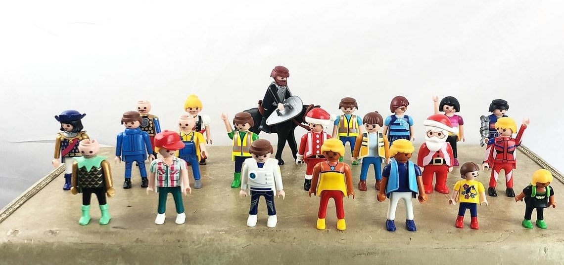 18 different Playmobil figures all standing up