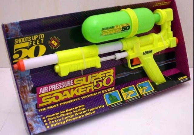 A shot of a neon yellow and green SuperSoaker 50 in its box