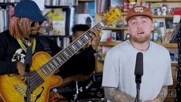 A clip of Thundercat playing the guitar and Mac Miller rapping at an intimate gig
