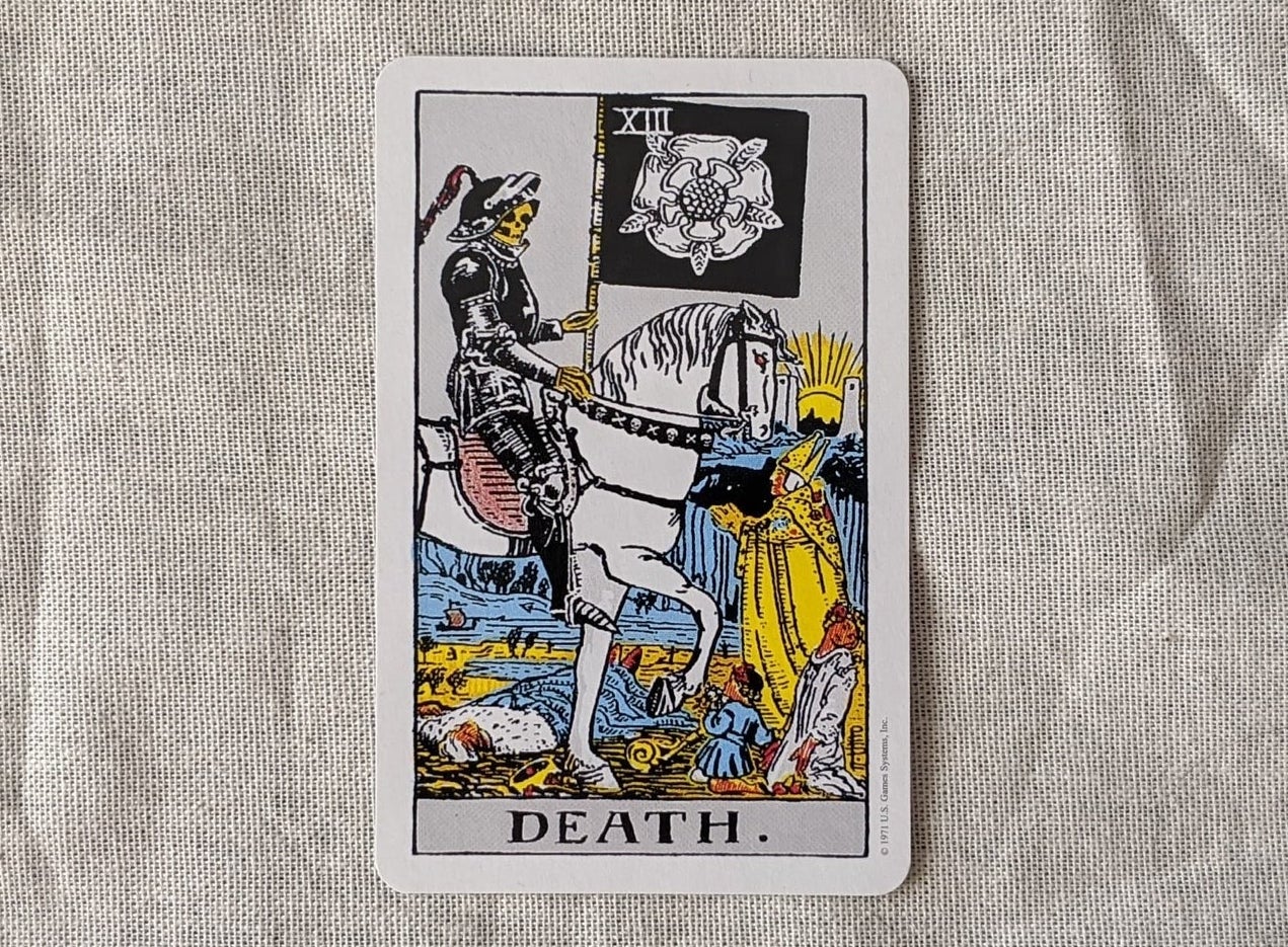 The death card from the Rider-Waite deck lays face up 