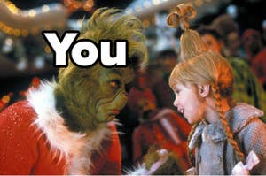 The word "you" written over The Grinch as he speaks with Cindy Lou