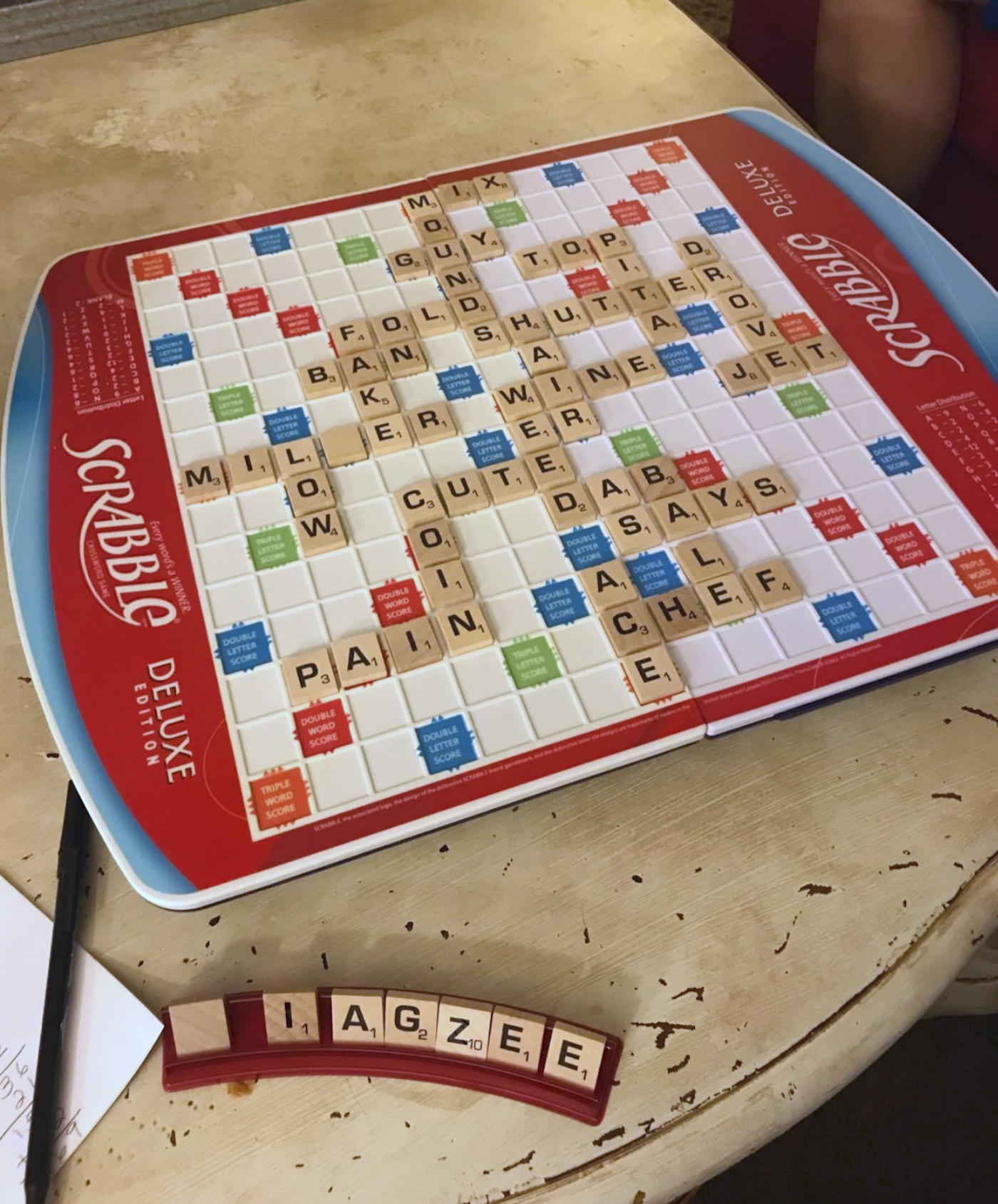 the scrabble board with a game in process