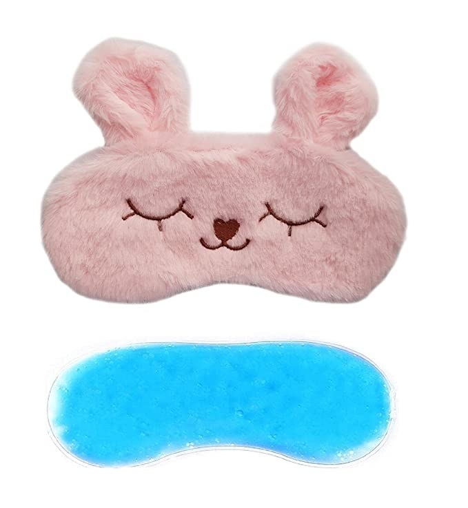 Pink fuzzy eye mask with bunny ears.