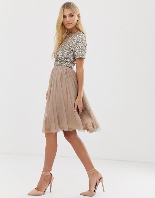 a model wearing the midi length flowy tulle skirt