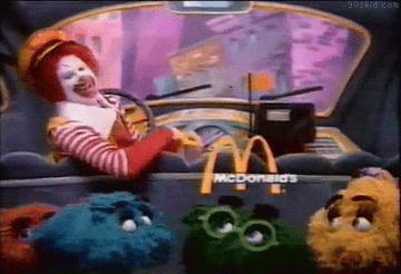 Ronald McDonald the clown and his nugget friends chilling in a car for a vintage McDonald&#x27;s commercial 