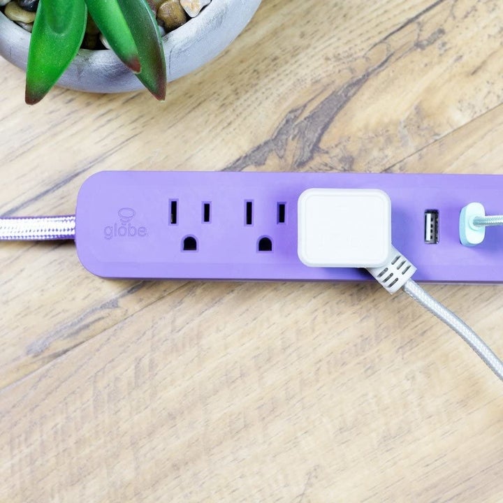 purple power strip with three outlets and two usb ports 