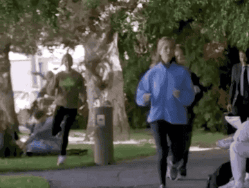 Phoebe running fast and awkwardly past Rachel