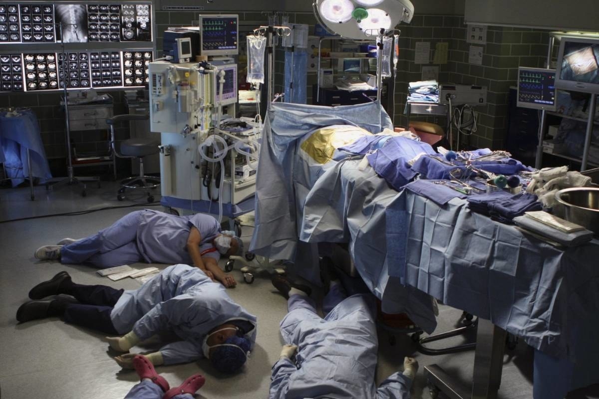An ER room with medical staff passed out on the floor