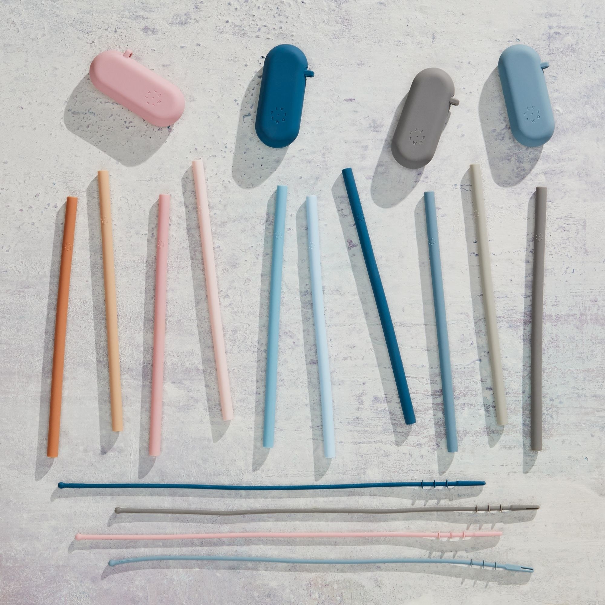 ten multicolored straws with four cases and four cleaners