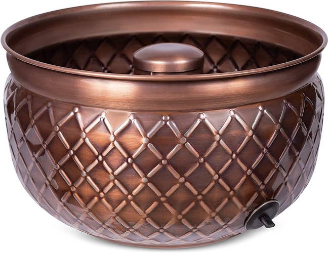 an embossed copper hose pot