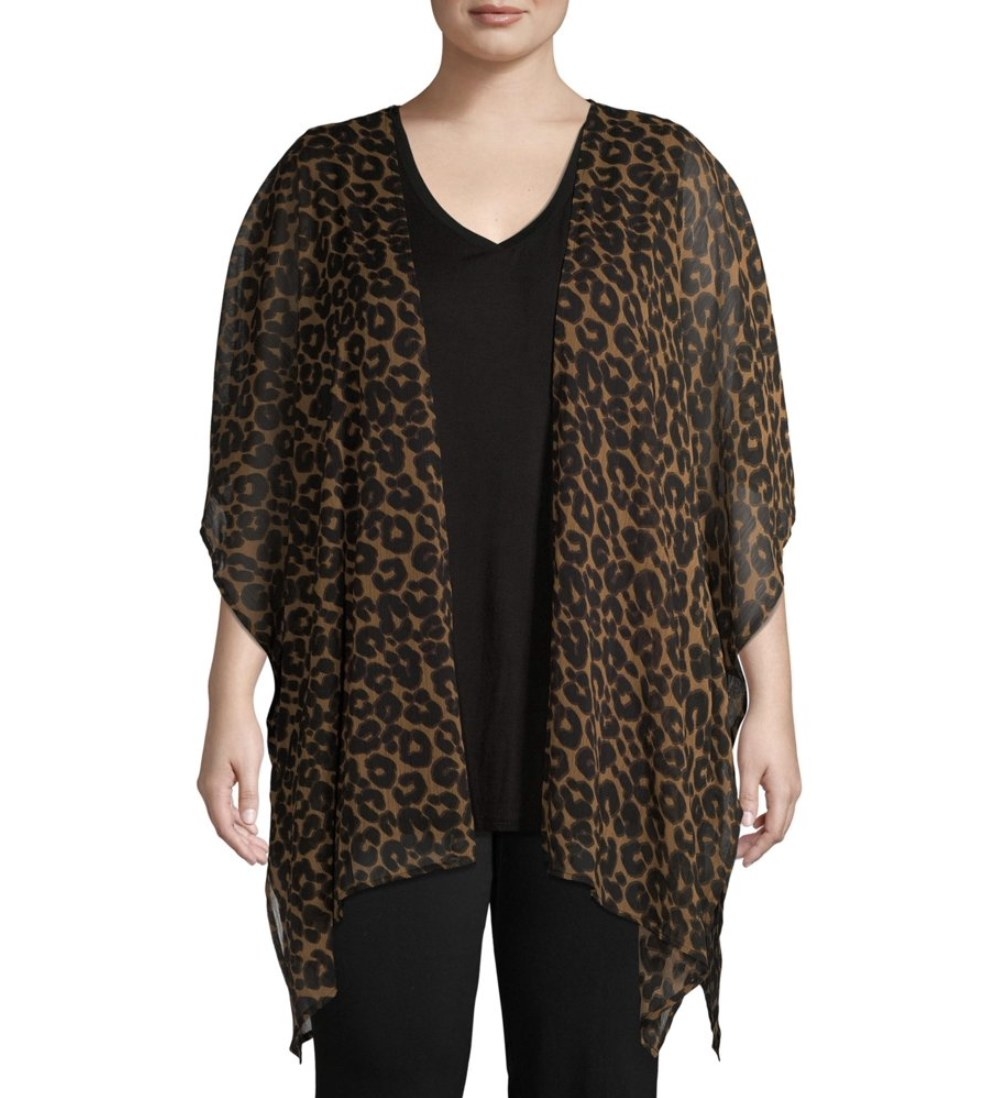 A model in an open draped cheetah print cardigan