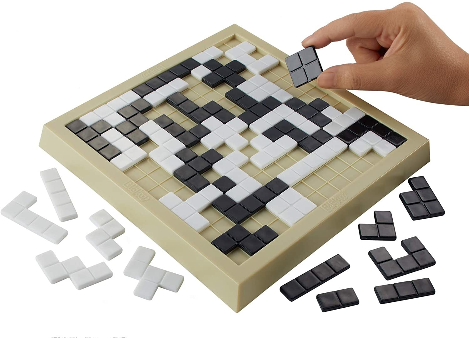 The Blokus board with white and black geometric tiles on it