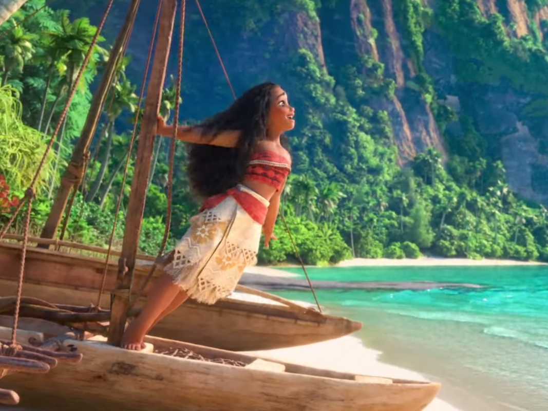 Moana in her skirt and top outfit on the beach