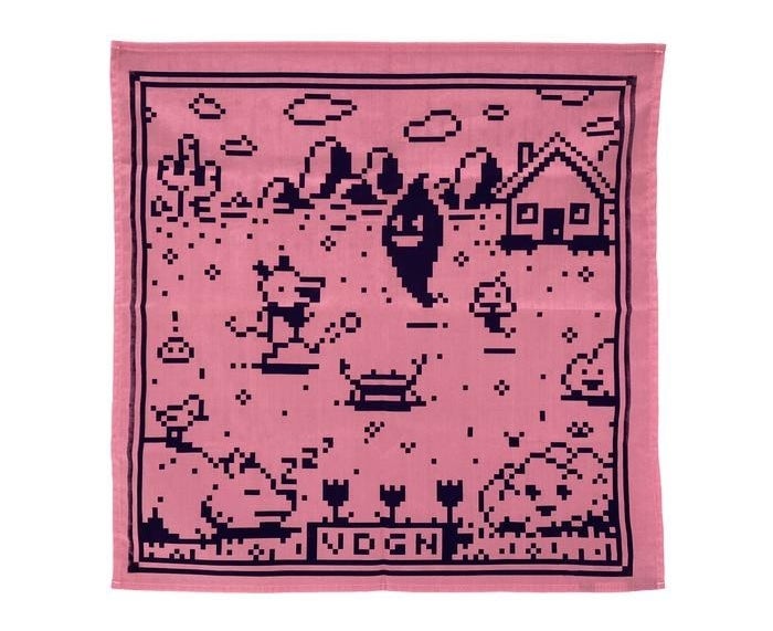 pink bandana with little video game critters on a field with a cactus and a house in the background. the bottom says VDGN