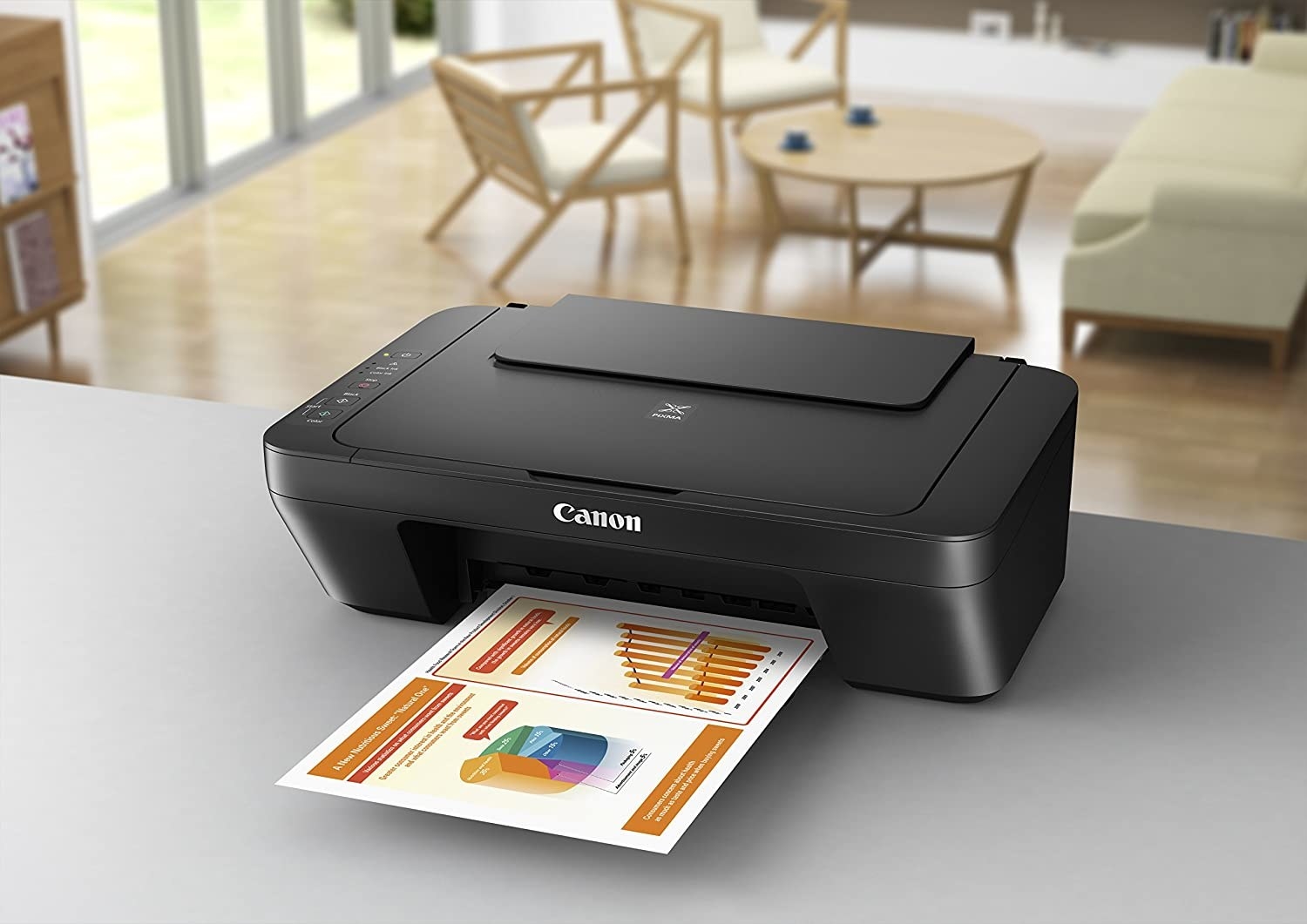 A printer on a desk printing a document