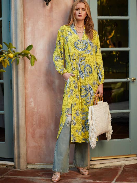 Model wearing the paisley dress in yellow 