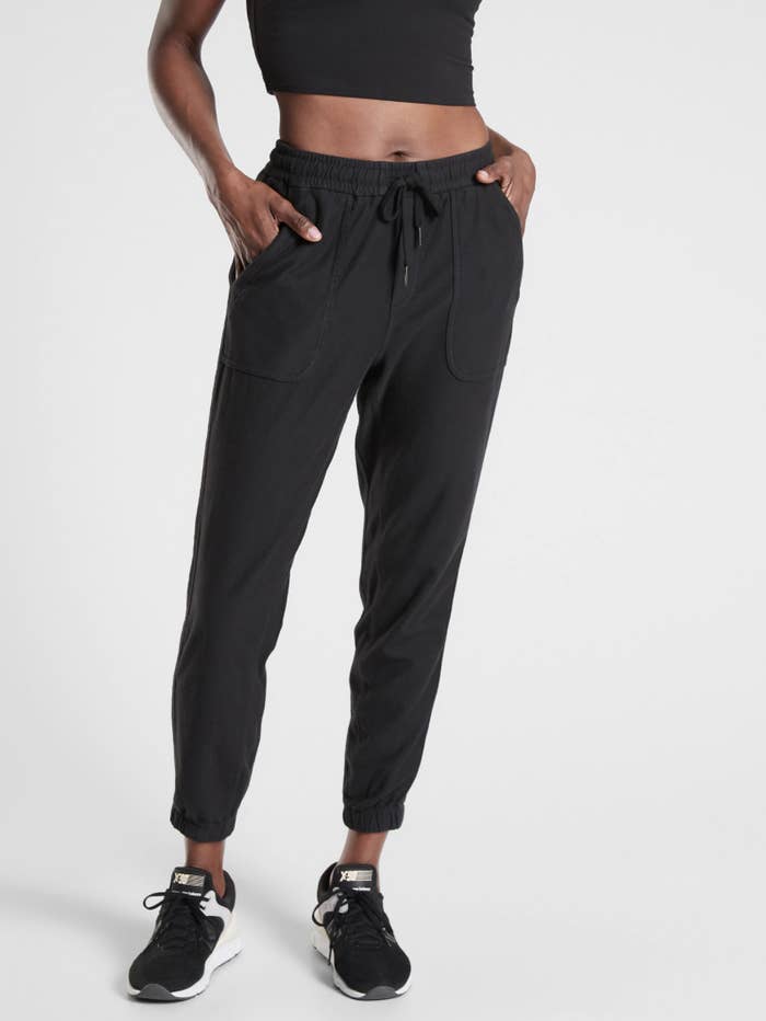 A model wearing the joggers, which gather at the ankles and have a drawstring waist