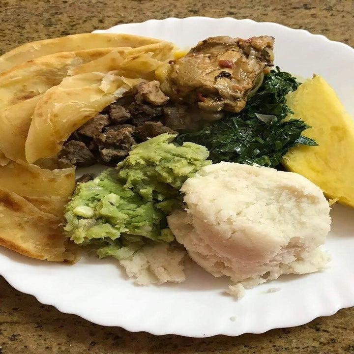 plate of Kenyan food, including flatbread and green vegetables