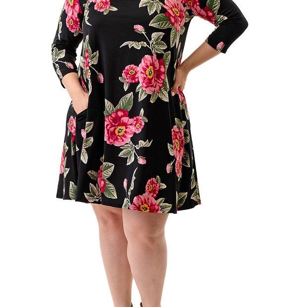 Model wearing the dress in black with pink flowers 