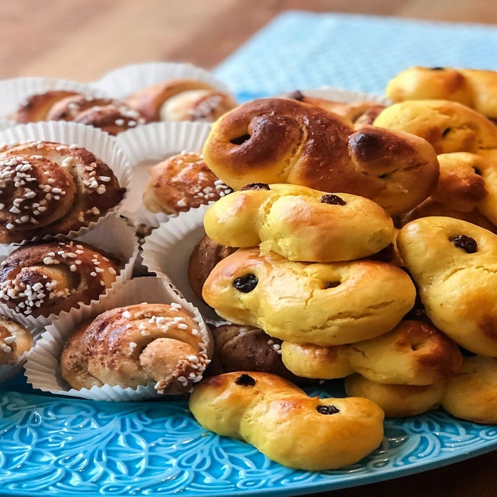 cinnamon buns and other pastries on a plate