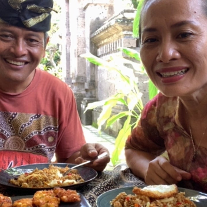 The hosts, Ngurah &amp; Ayu, chatting to students on video chat while eating Indonesian food