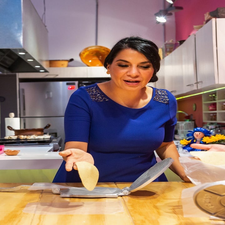 The host, Graciela, holding a freshly pressed corn tortilla