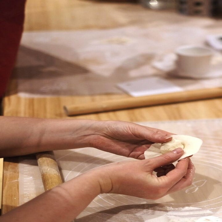 close up of a dumpling being folded