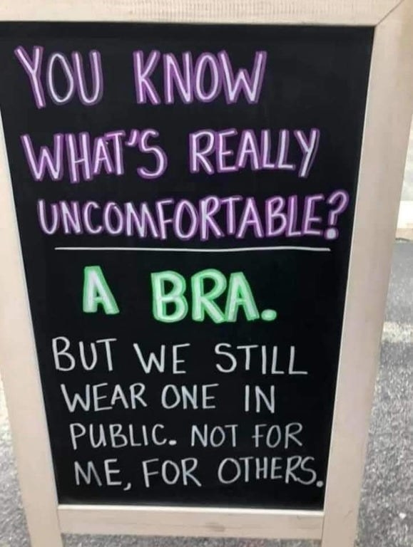 Sign reading you know what&#x27;s really uncomfortable a bra but we still wear on in public