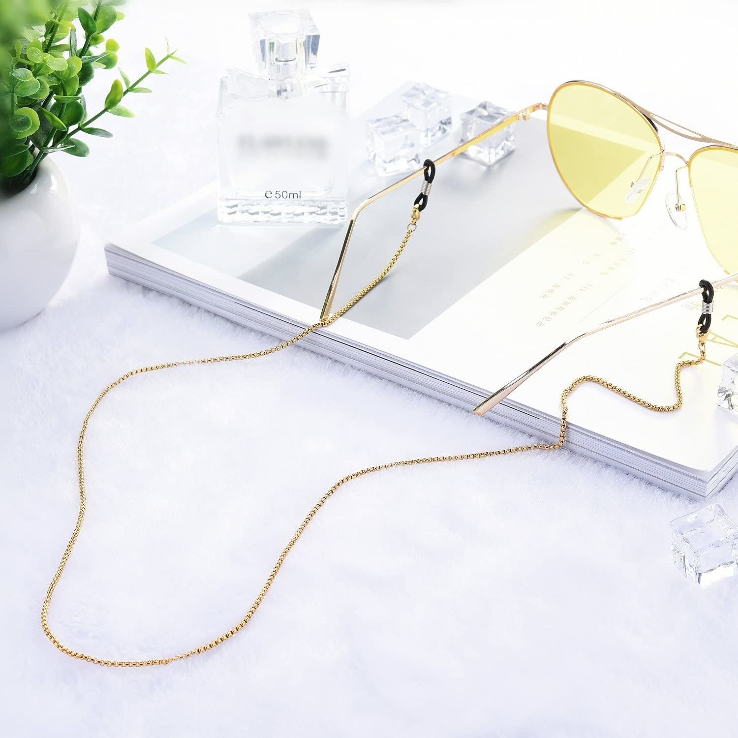 The sunglasses chain attached to a pair of aviator glasses