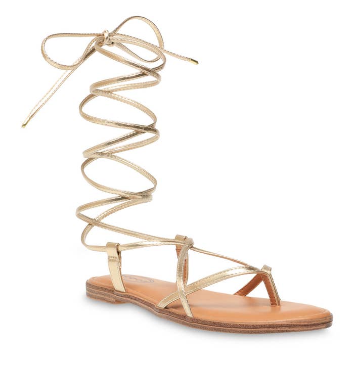 A light gold lace-up thong sandal