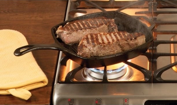 The cast iron grill pan cooking steak