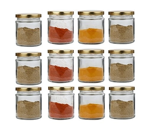 Glass jars with golden lids storing masalas