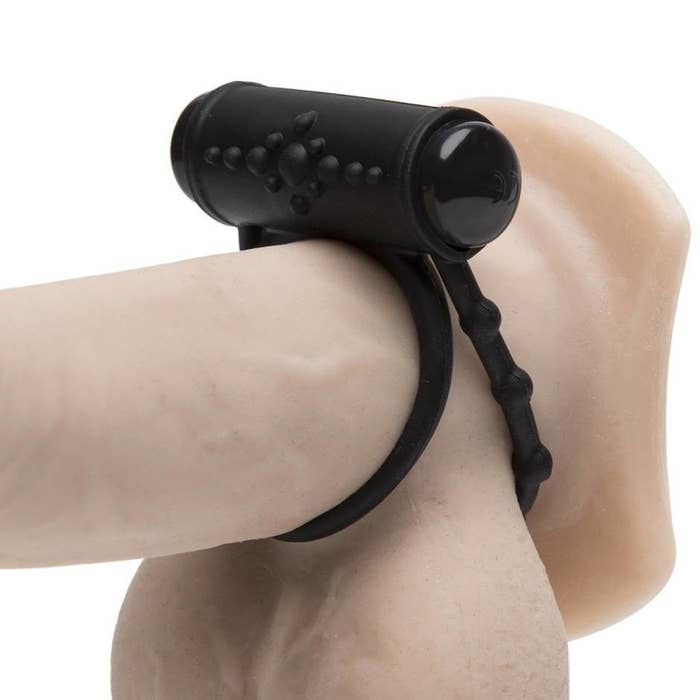 The Tracey Cox Supersex rechargeable vibrating love ring strapped to a realistic dildo