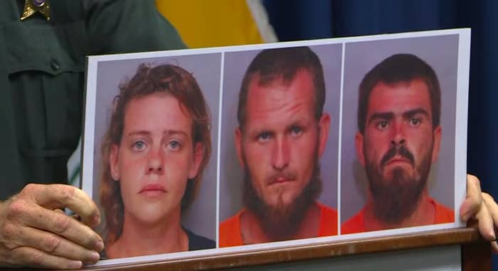 A screengrab of the press conference showing the mugshots of the three charged.