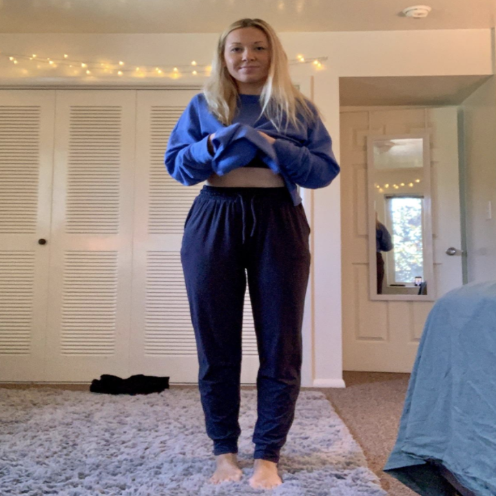 a reviewer wearing the pants in navy
