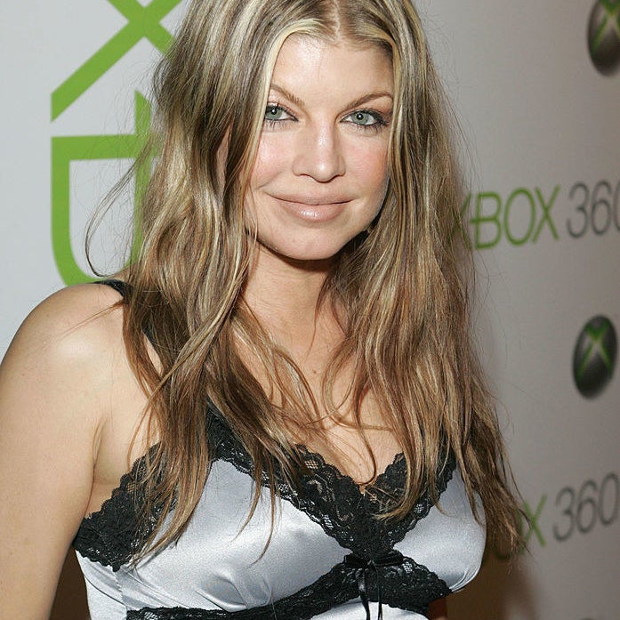 Fergie has wavy hair and light highlights