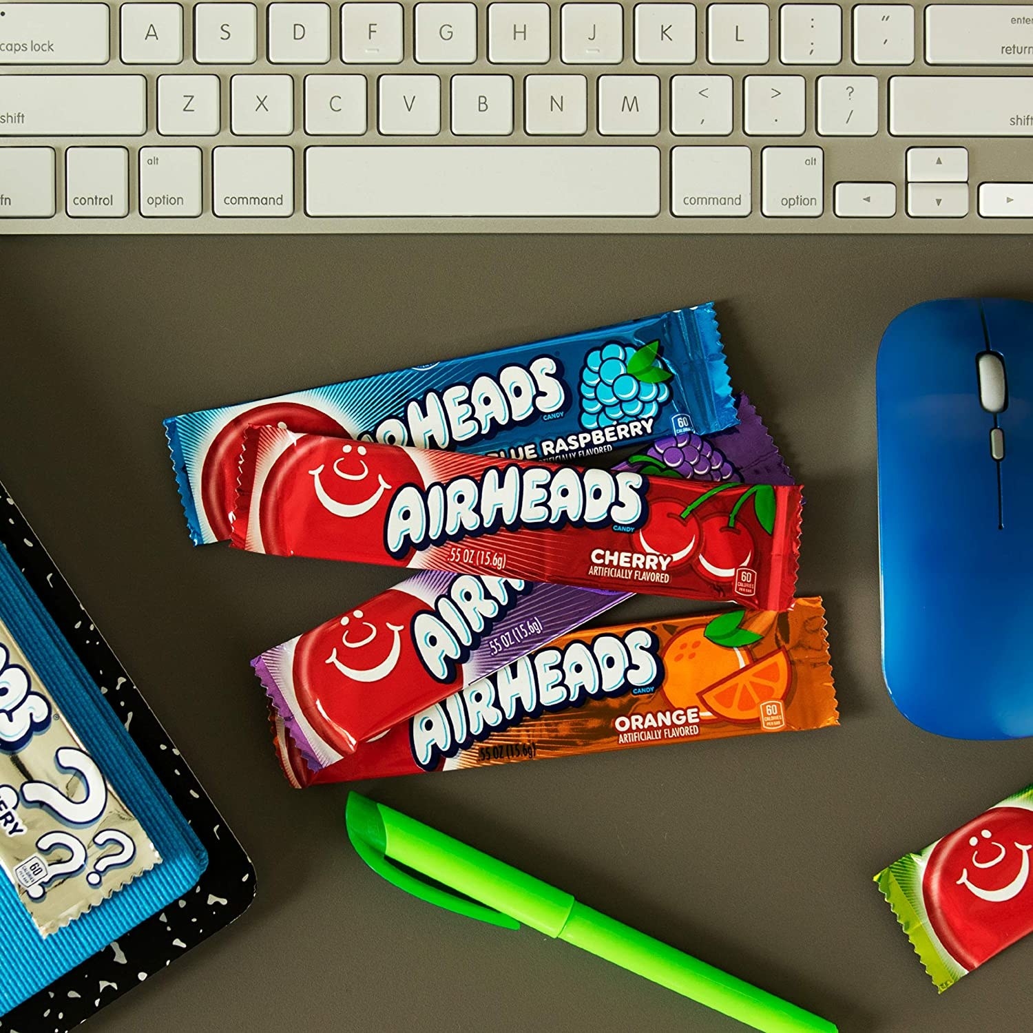 Airheads next to a keyboard on a desk