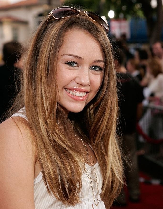 Miley's signature look in 2006: long brunette hair and contrasting lighter highlights