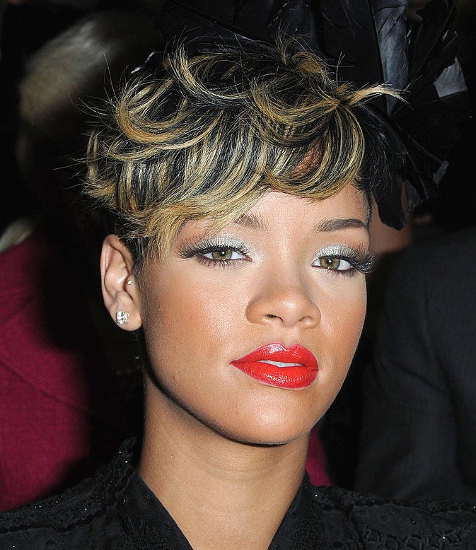 Rihanna has a short hairstyle with bright highlights