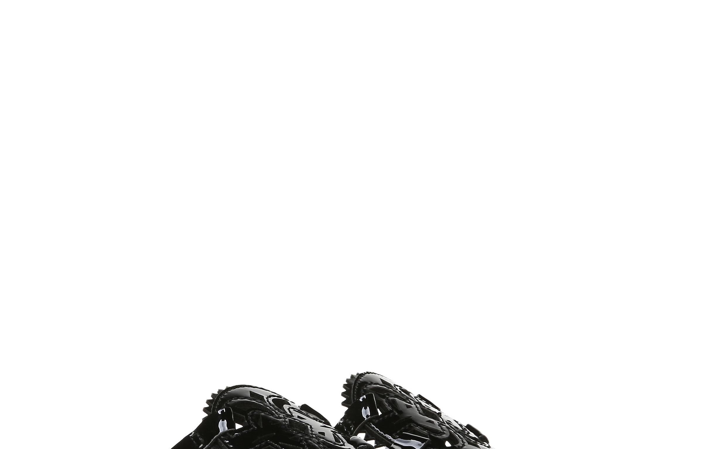A pair of shiny black sandals 