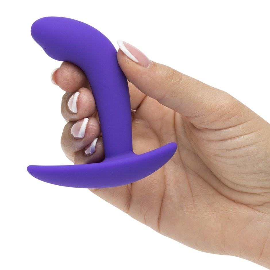 The Lovehoney Booty Buddy silicone butt plug in a model's hand