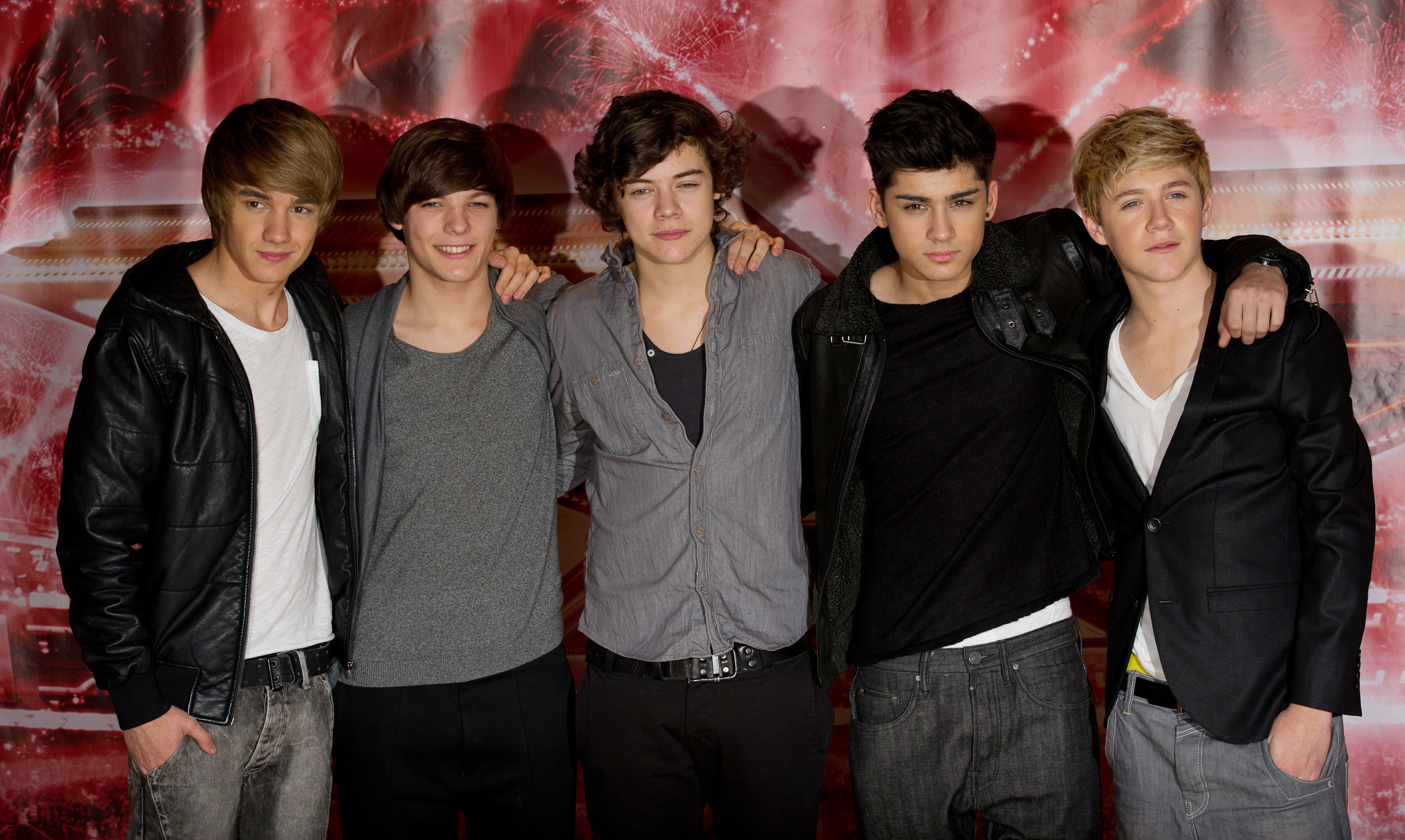 One Direction taking a photo together in 2010 to promote the finale of The X Factor