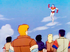 A GIF of the Planeteers cheering on Captain Planet
