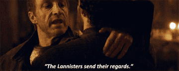 Roose Bolton holds Robb Stark by the shoulder and goes to stab him off screen. The text The Lannisters send their regards in subtitled below